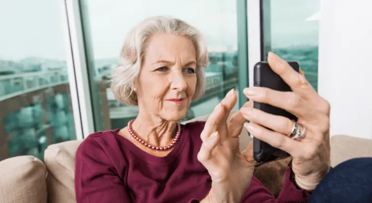 Elderly woman using her smartphone